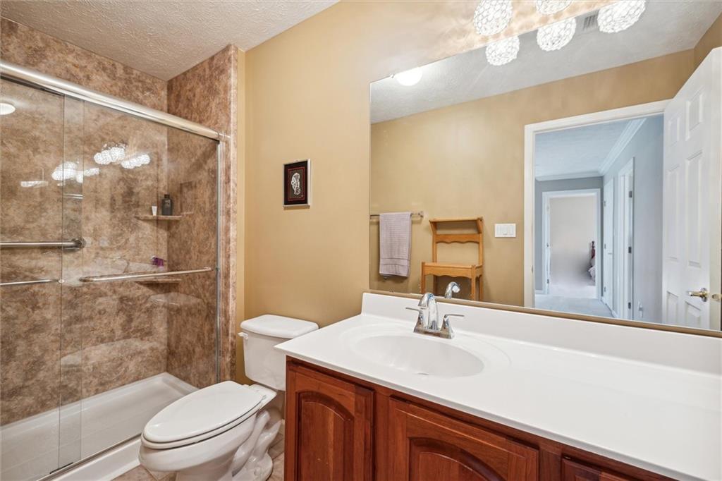 136 Park Place McKees Rocks, PA 15136 - Photo 34 of 49 a bathroom with a sink a toilet a mirror and shower