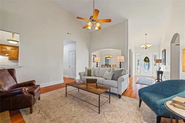 a dining room with furniture a rug and wooden floor