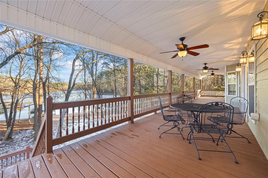 80 Hardy Farms Point Martin, GA 30557 - Photo 27 of 84 a view of a patio with table and chairs and wooden floor