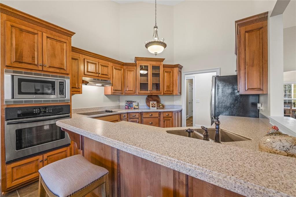 80 Hardy Farms Point Martin, GA 30557 - Photo 33 of 84 a kitchen with stainless steel appliances granite countertop a sink stove and refrigerator