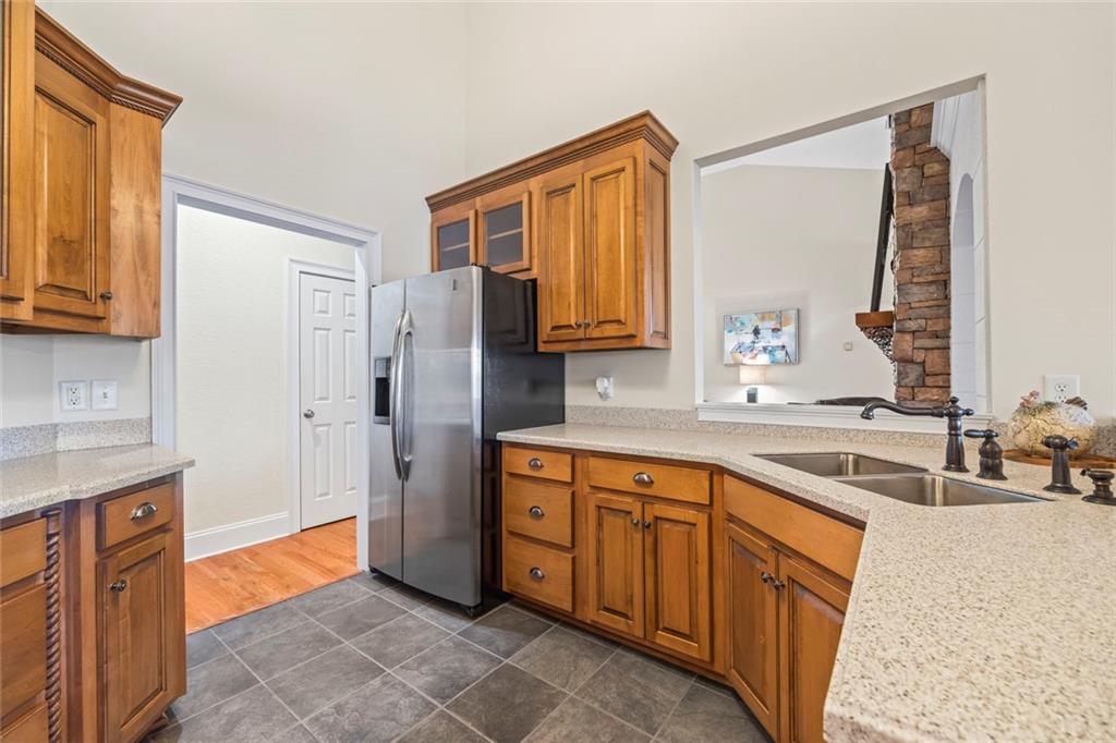 80 Hardy Farms Point Martin, GA 30557 - Photo 35 of 84 a kitchen with stainless steel appliances granite countertop a sink and a refrigerator