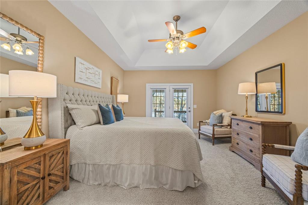 80 Hardy Farms Point Martin, GA 30557 - Photo 41 of 84 a bedroom with a bed and a chandelier