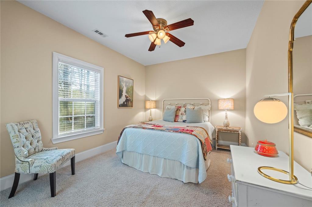 80 Hardy Farms Point Martin, GA 30557 - Photo 51 of 84 a bedroom with a bed and a chair