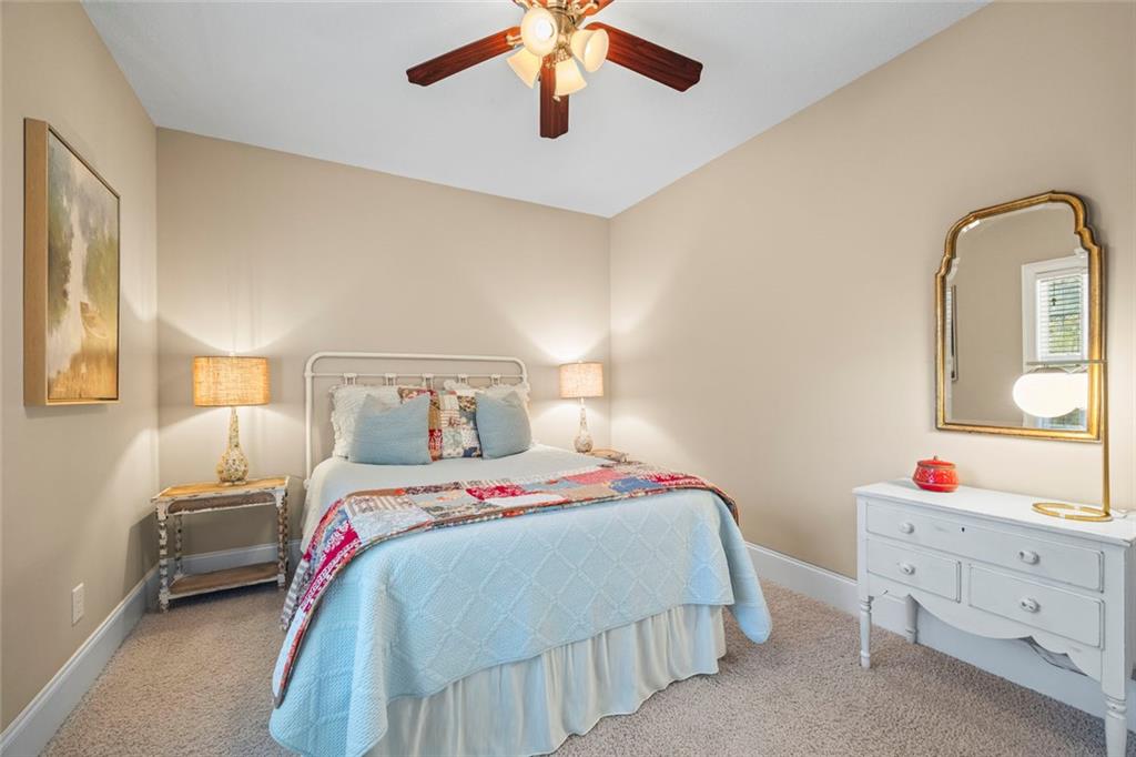 80 Hardy Farms Point Martin, GA 30557 - Photo 52 of 84 a bedroom with a bed and a chandelier