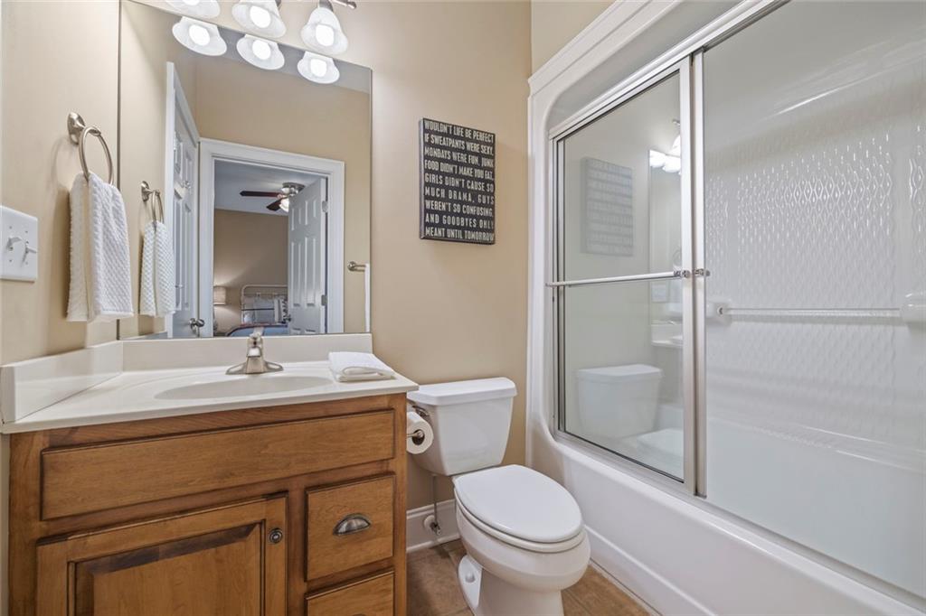 80 Hardy Farms Point Martin, GA 30557 - Photo 54 of 84 a bathroom with a sink toilet vanity and shower