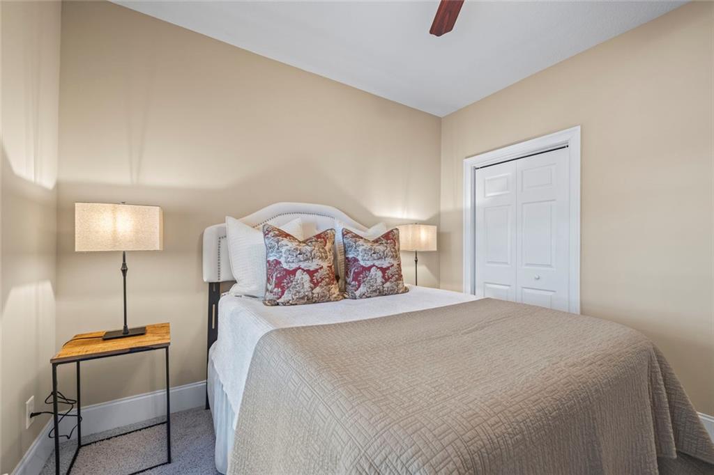 80 Hardy Farms Point Martin, GA 30557 - Photo 56 of 84 a bedroom with a bed a table and painting on the wall