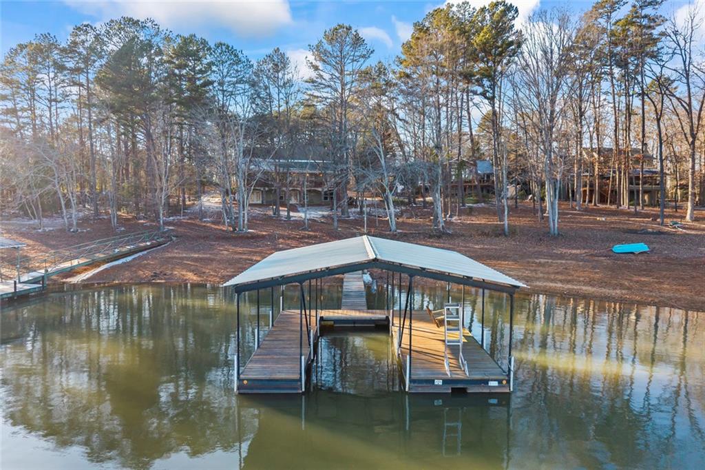 80 Hardy Farms Point Martin, GA 30557 - Photo 10 of 84 a view of swimming pool with outdoor seating and lake view