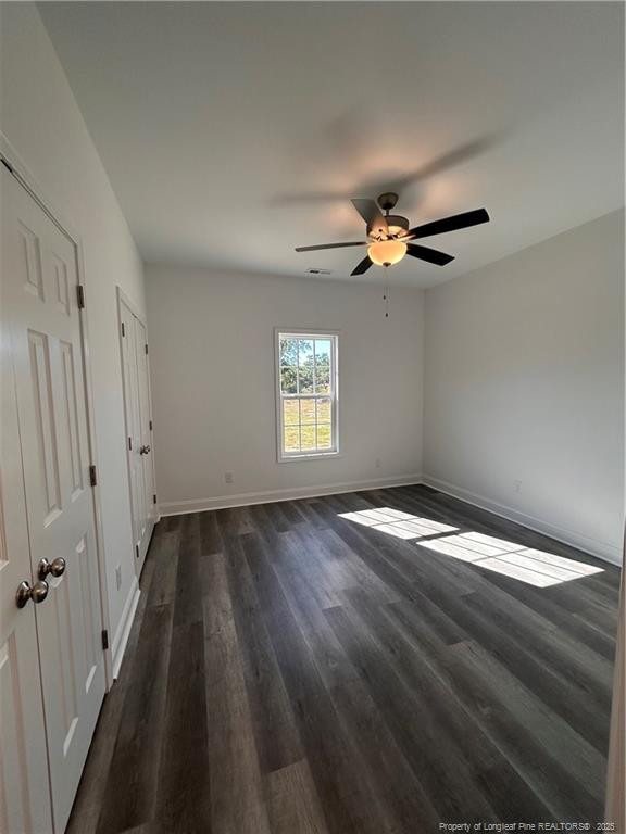 407 Morehead Street Spring Lake, NC 28390 - Photo 7 of 12 wooden floor in an empty room with a window