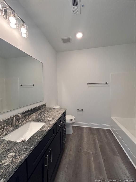 407 Morehead Street Spring Lake, NC 28390 - Photo 9 of 12 a bathroom with a granite countertop sink and a mirror