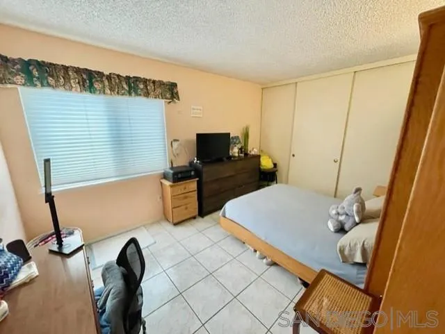 119 Linaza Lane Spring Valley, CA 91977 - Photo 14 of 36 a living room with furniture and a flat screen tv