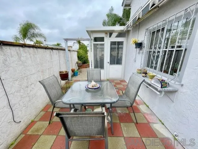 119 Linaza Lane Spring Valley, CA 91977 - Photo 28 of 36 a view of a patio with a table and chairs
