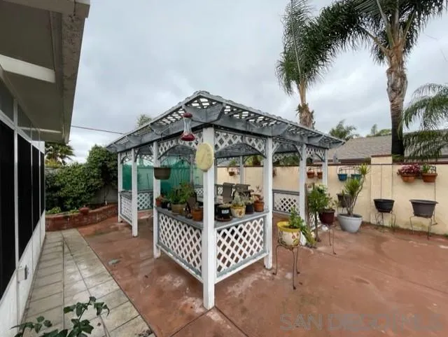 119 Linaza Lane Spring Valley, CA 91977 - Photo 32 of 36 a view of a chairs setting on the deck in front of house