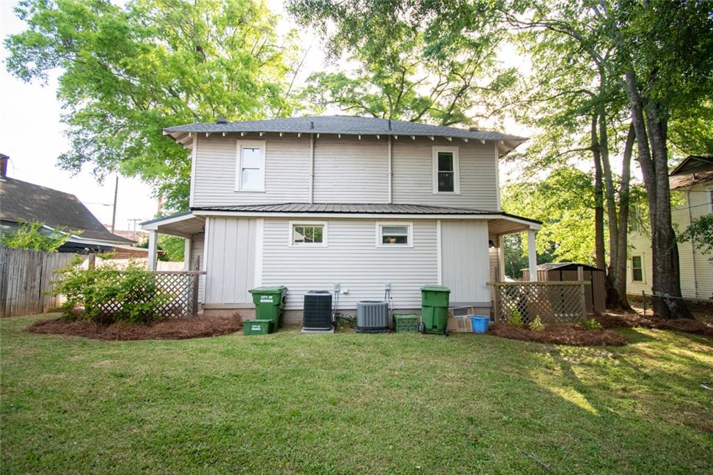 702 Radford Street Monroe, GA 30655 - Photo 46 of 49 a front view of house with yard