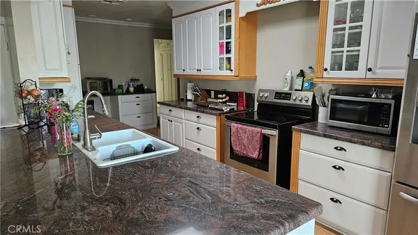 a kitchen with a stove and a sink