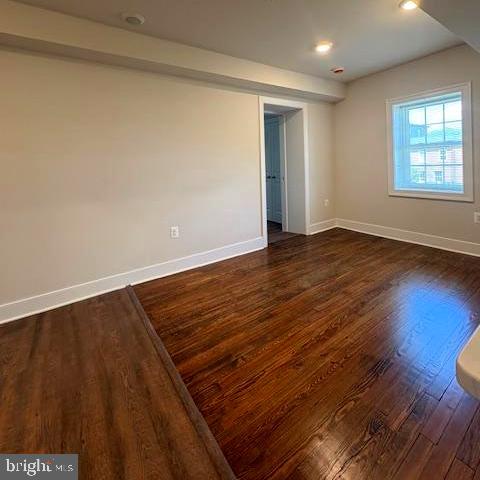 202 Princess Anne Street Fredericksburg, VA 22401 - Photo 6 of 6 a view of an empty room with wooden floor and a window
