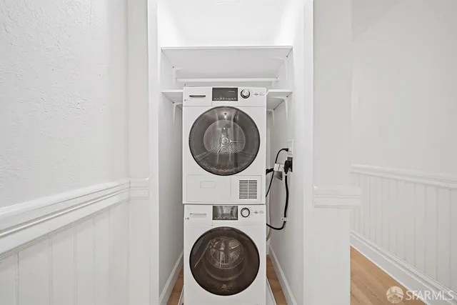 a close view of a utility room with dryer and washer
