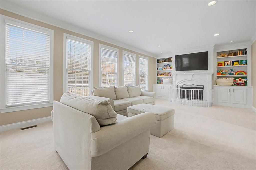 2018 Cockrell Pointe Northwest Kennesaw, GA 30152 - Photo 15 of 51 a living room with furniture and a flat screen tv