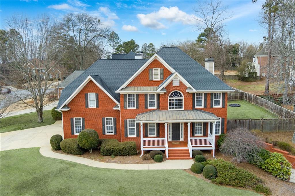 2018 Cockrell Pointe Northwest Kennesaw, GA 30152 - Photo 2 of 51 a front view of a house with a yard