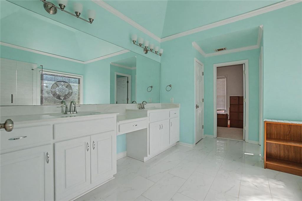 2018 Cockrell Pointe Northwest Kennesaw, GA 30152 - Photo 22 of 51 a spacious bathroom with a double vanity sink a mirror and a