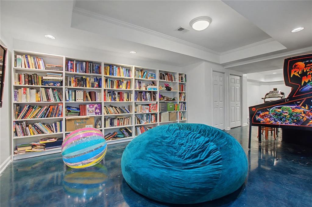2018 Cockrell Pointe Northwest Kennesaw, GA 30152 - Photo 29 of 51 a room with bookshelf and a chair