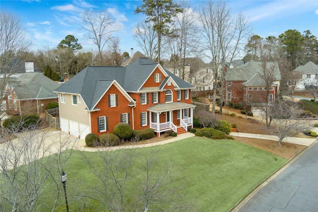 2018 Cockrell Pointe Northwest Kennesaw, GA 30152 - Photo 3 of 51 a front view of a house with a garden