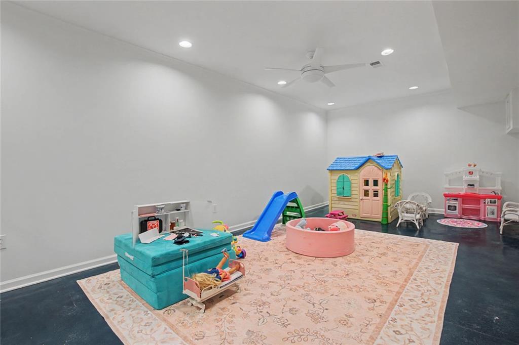 2018 Cockrell Pointe Northwest Kennesaw, GA 30152 - Photo 33 of 51 a room with furniture and a wooden floor