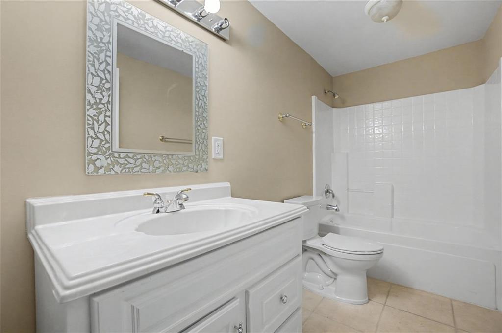 2018 Cockrell Pointe Northwest Kennesaw, GA 30152 - Photo 35 of 51 a bathroom with a sink toilet and shower