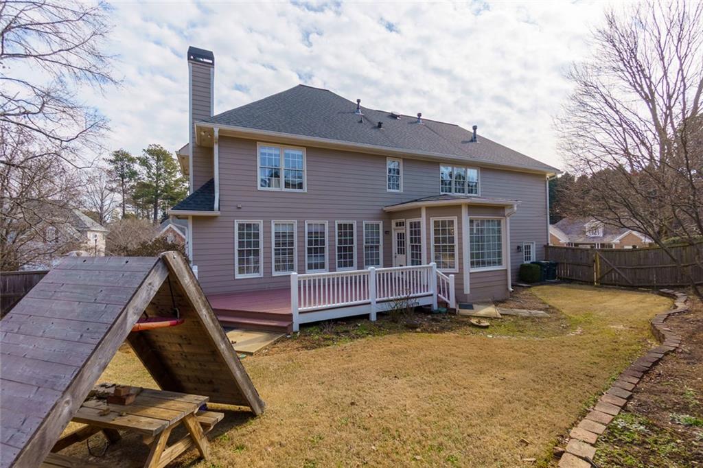 2018 Cockrell Pointe Northwest Kennesaw, GA 30152 - Photo 40 of 51 a view of a house with a yard