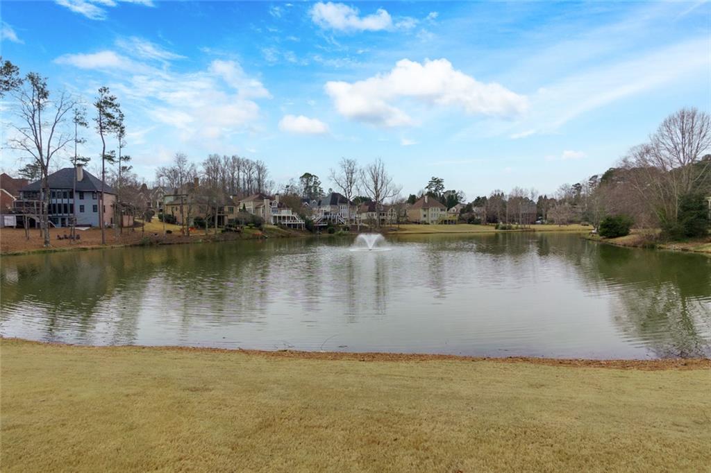 2018 Cockrell Pointe Northwest Kennesaw, GA 30152 - Photo 43 of 51 a view of a lake with houses in the back