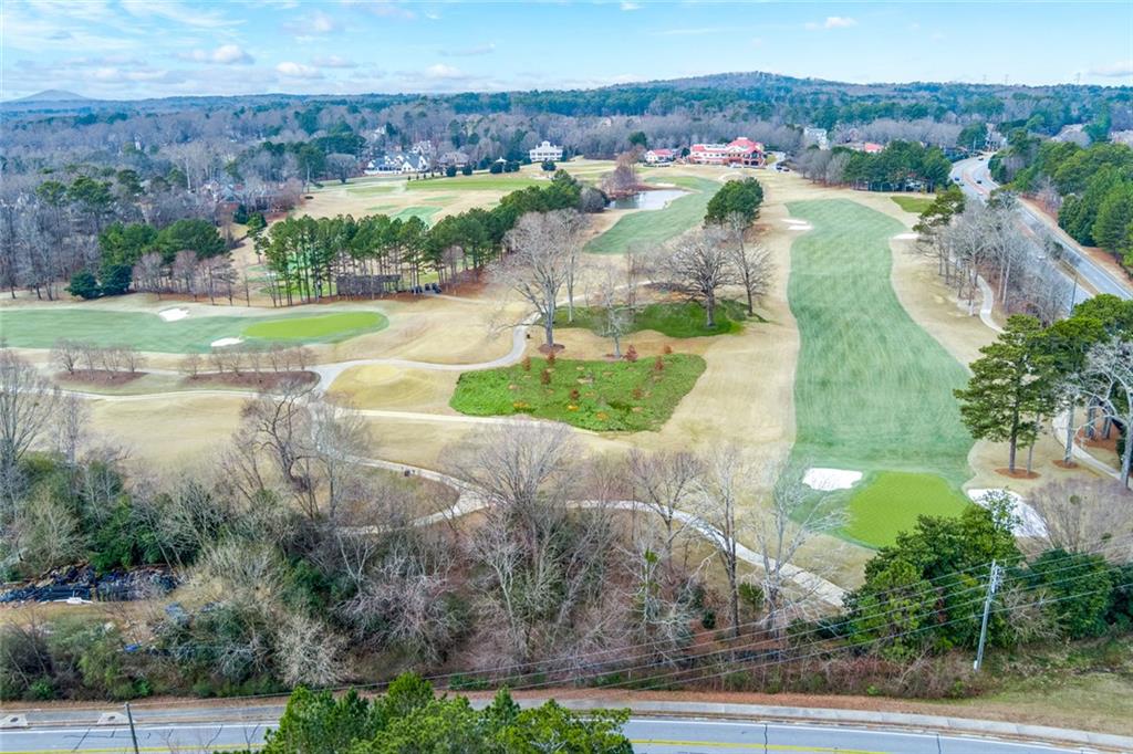 2018 Cockrell Pointe Northwest Kennesaw, GA 30152 - Photo 48 of 51 an aerial view of a houses with yard and green space