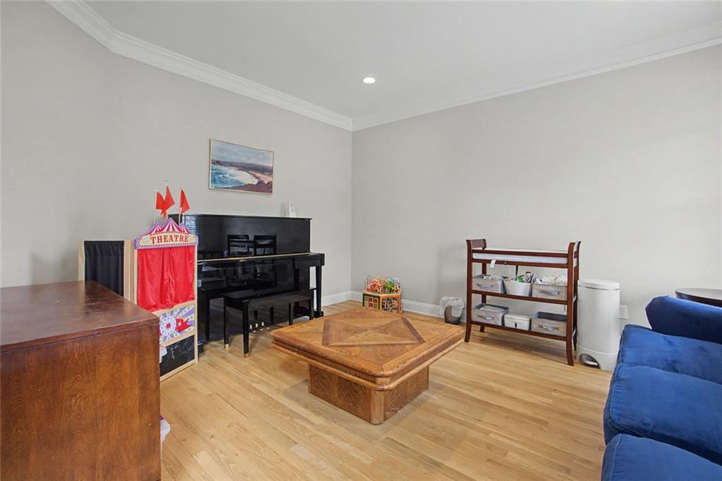 2018 Cockrell Pointe Northwest Kennesaw, GA 30152 - Photo 6 of 51 a living room with furniture a flat screen tv and a table