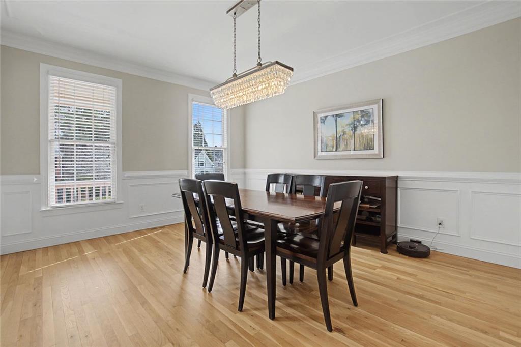 2018 Cockrell Pointe Northwest Kennesaw, GA 30152 - Photo 8 of 51 a view of a dining room with furniture and wooden floor