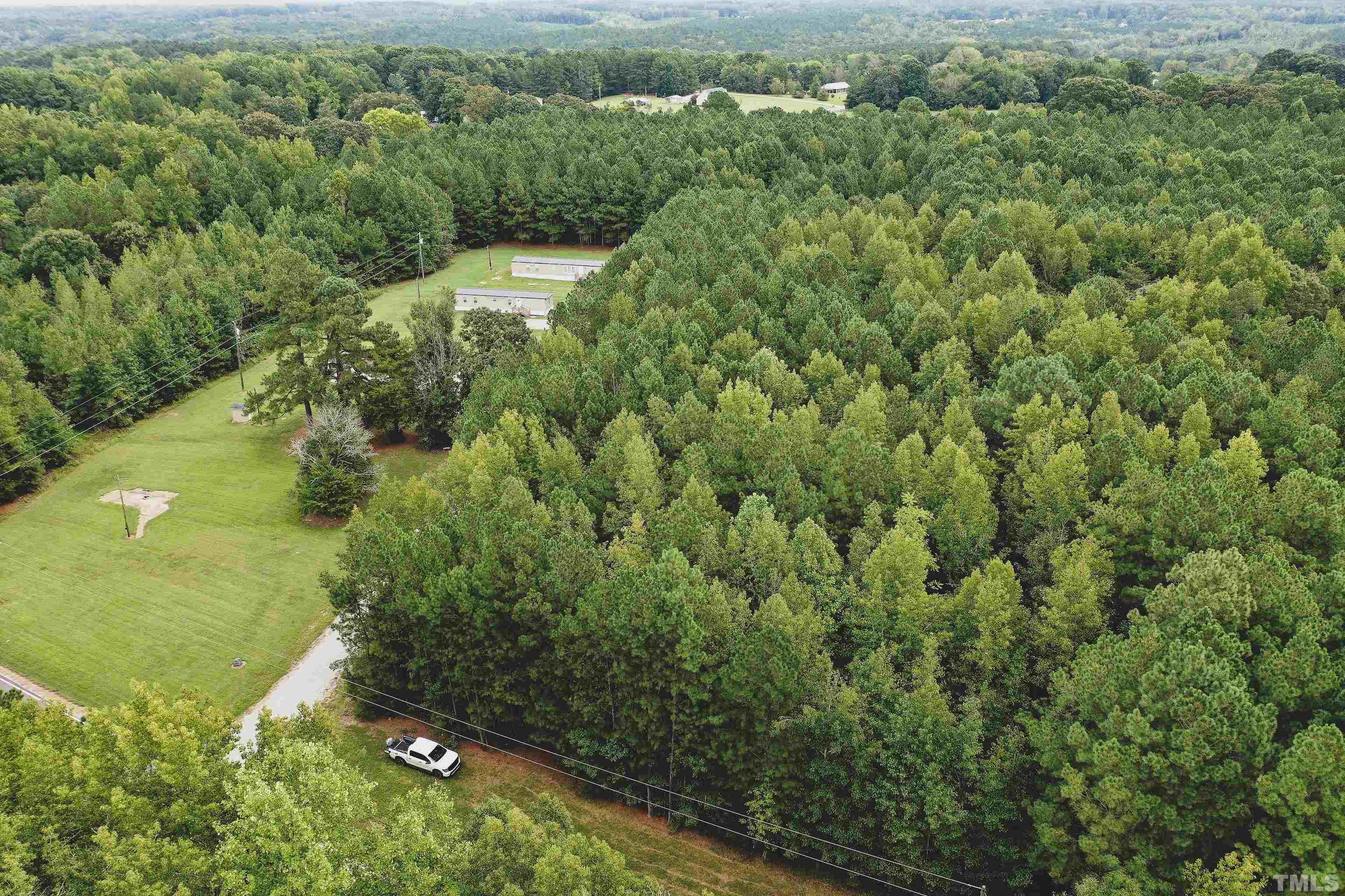 5-acres South Chavis Road Kittrell, NC 27544 - Photo 22 of 25 an aerial view of a house with a yard