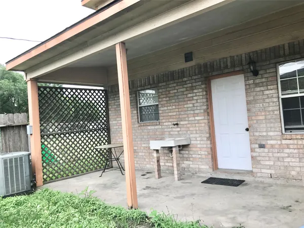 a front view of a house with a gate
