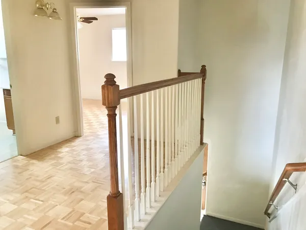 a view of a hallway view with staircase