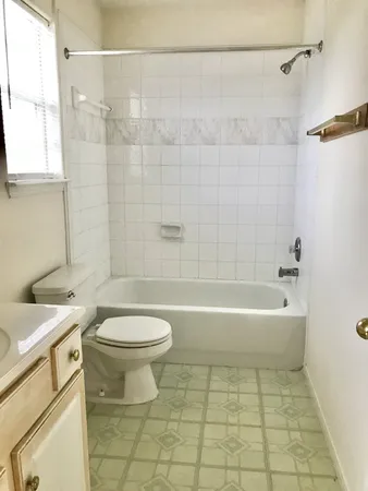 a bathroom with a sink a toilet and a bathtub