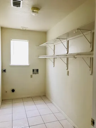 a view of a room with racks on the wall