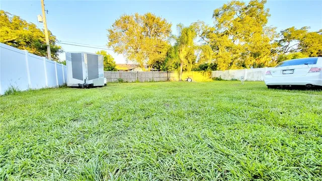 a view of yard with swimming pool