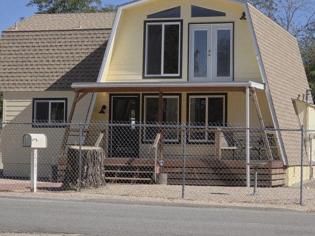 a view of a house with more windows and plants