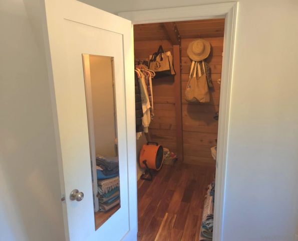 a bathroom with a shower and a mirror