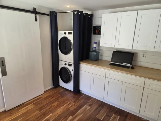 a kitchen with a refrigerator and cabinets