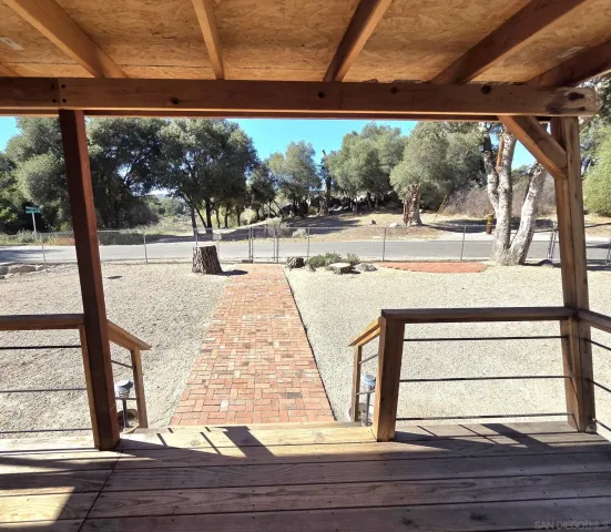 a view of a living room and floor to ceiling window or wooden floor