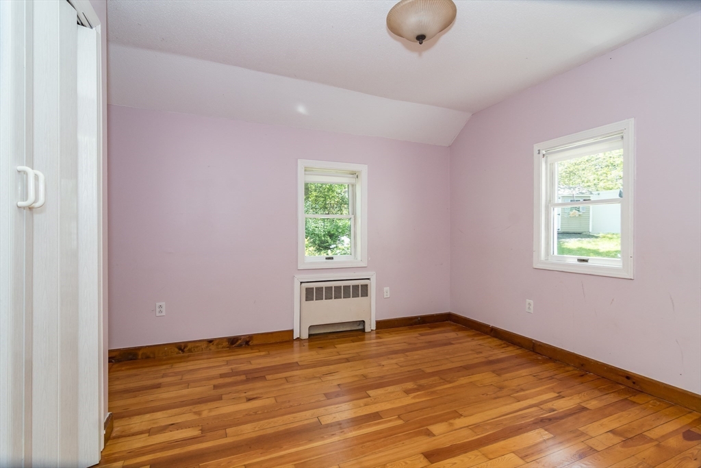 62 Sycamore Road Wayland, MA 01778 - Photo 6 of 16 an empty room with wooden floor and windows