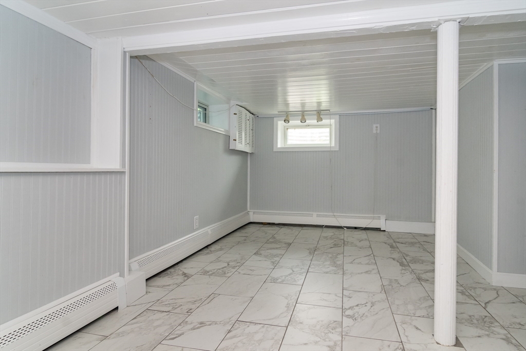 62 Sycamore Road Wayland, MA 01778 - Photo 8 of 16 a view of an empty room with a window