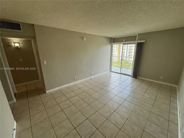 a view of an empty room and window