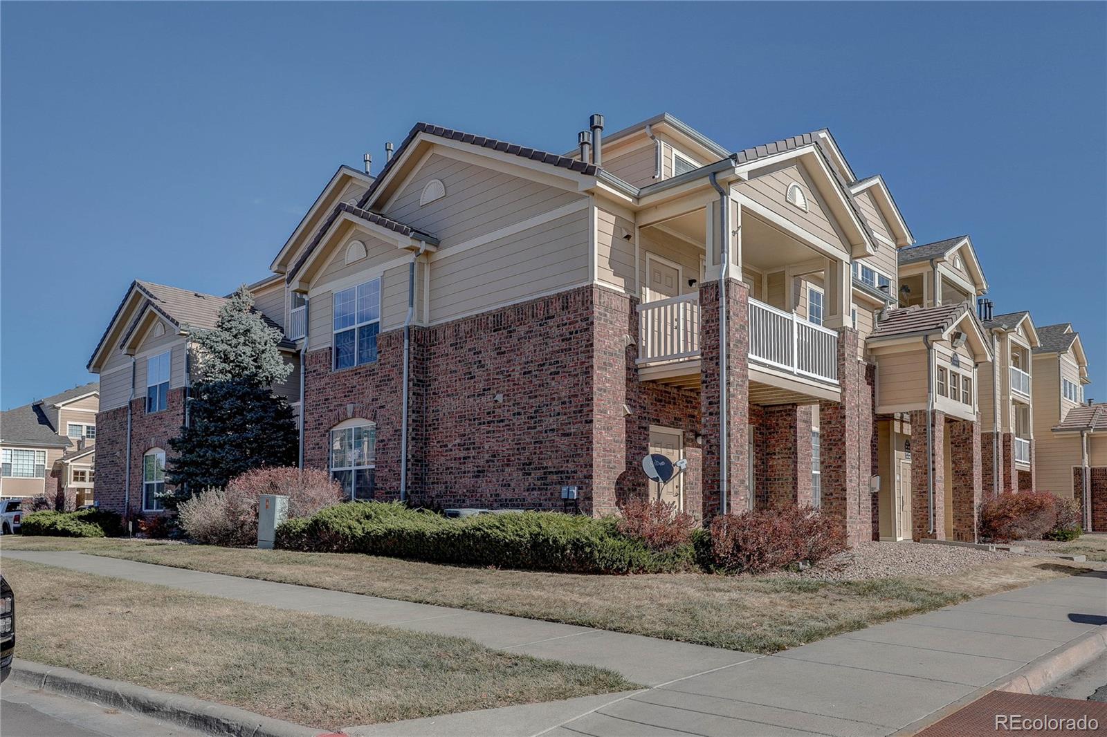 5756 North Genoa Way, Unit 12208 Aurora, CO 80019 - Photo 1 of 33 front view of a house with a street