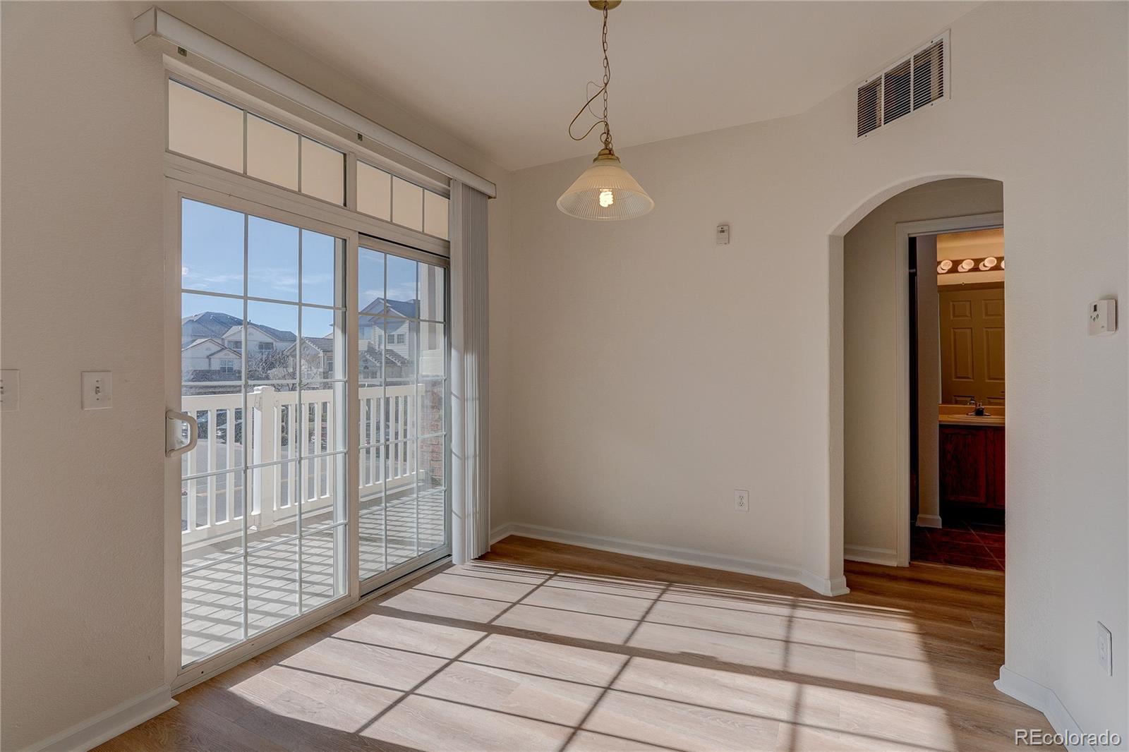 5756 North Genoa Way, Unit 12208 Aurora, CO 80019 - Photo 13 of 33 a view of an empty room with a window