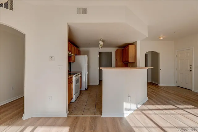 a view of a houses from a balcony