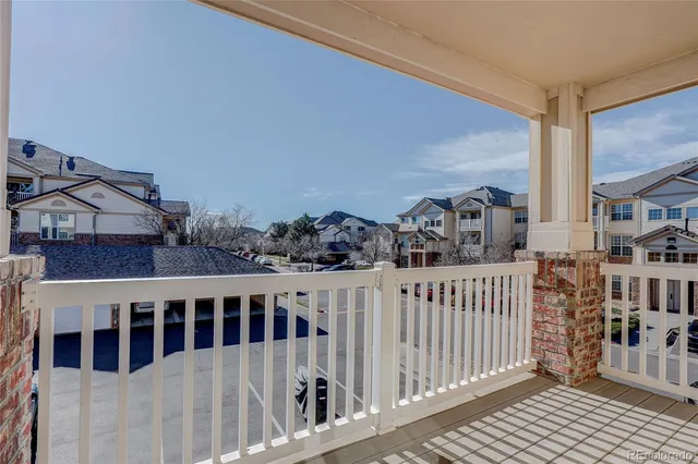 a kitchen with a refrigerator and a stove