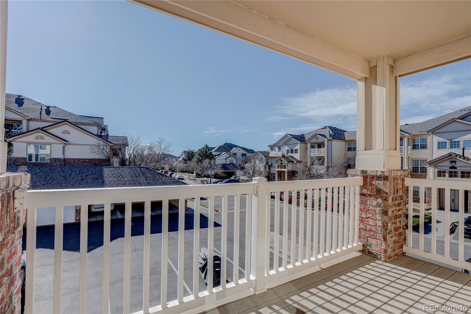 5756 North Genoa Way, Unit 12208 Aurora, CO 80019 - Photo 15 of 33 a view of a houses from a balcony
